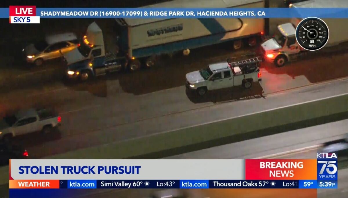 A stolen truck speeding on the freeway during a police chase 
