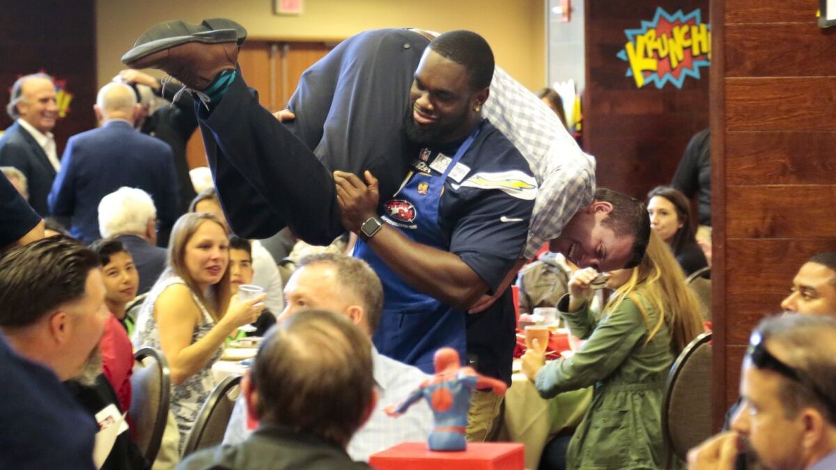 At the STAR/PAL luncheon in 2016, San Diego Chargers defensive end Chuka Ndulue, one of the celebrity waiters, carried Ryan Garcia during the fundraising event. $50 was donated to STAR/PAL for the ride. Now that the Chargers have moved, team participation is up in the air, too.