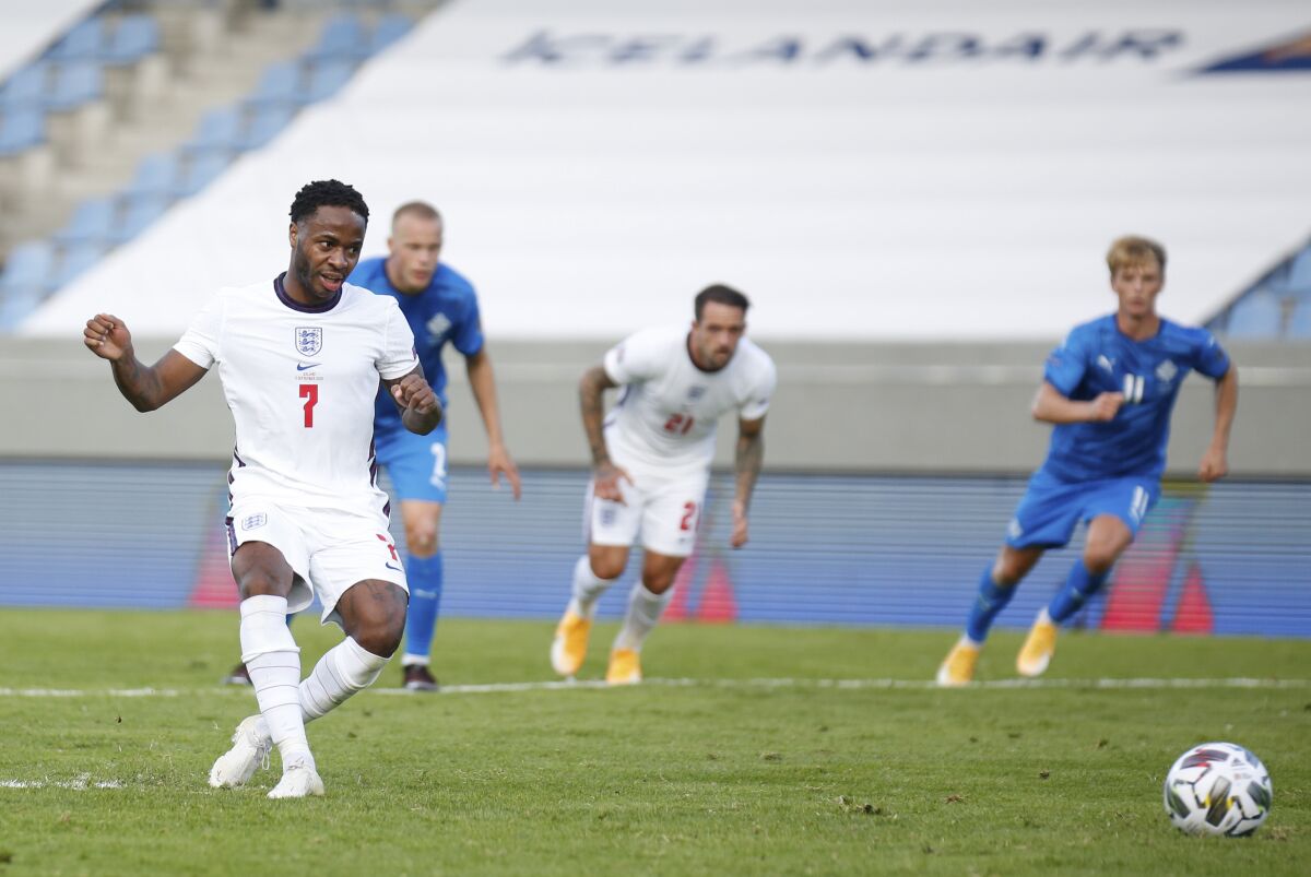 England's Raheem Sterling scores the opening goal from the penalty spot during the UEFA Nations League soccer match between Iceland and England in Reykjavik, Iceland, Saturday, Sept. 5, 2020. (AP Photo/Brynjar Gunnarson)