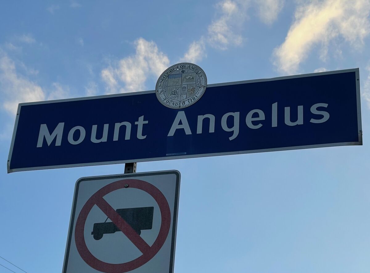 A blue and white neighborhood sign for Mount Angelus in northeast L.A.