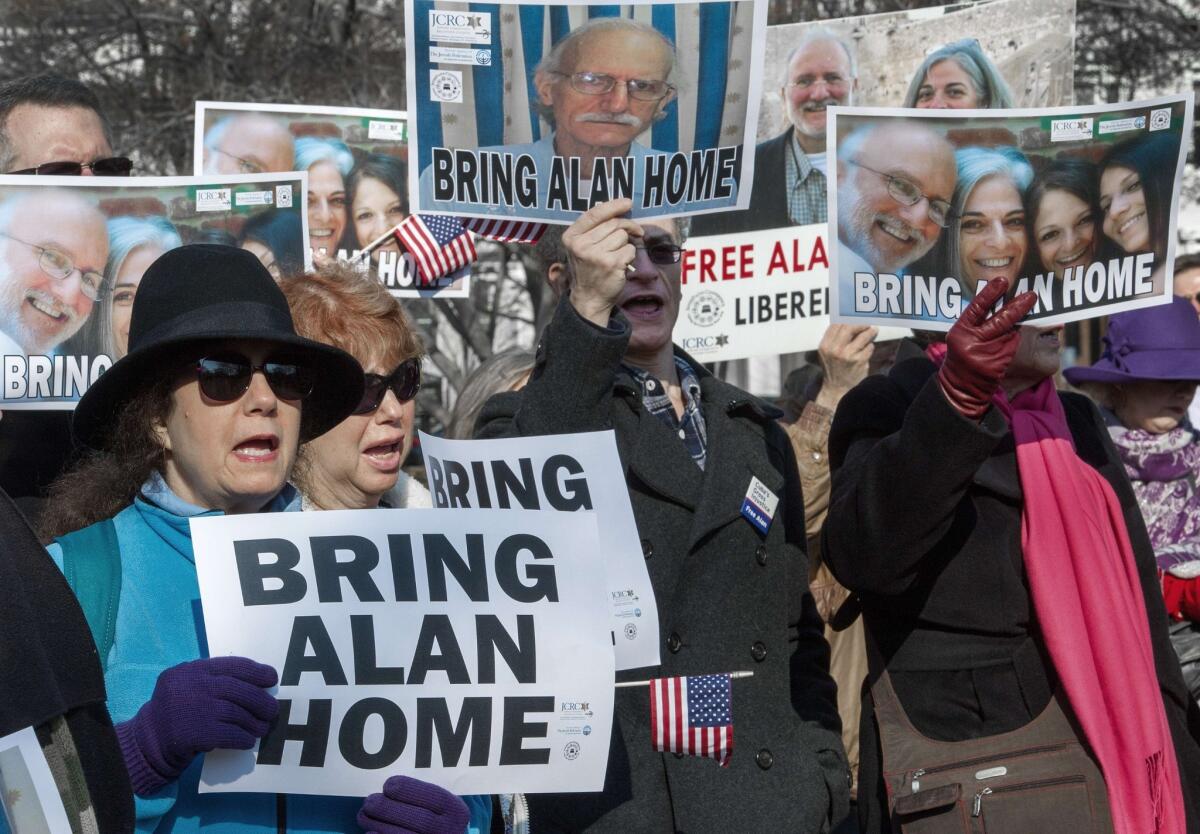 Supporters rally on behalf of Alan Gross, who has been in a Cuban prison for four years, during a rally in Lafayette Park in Washington, D.C.