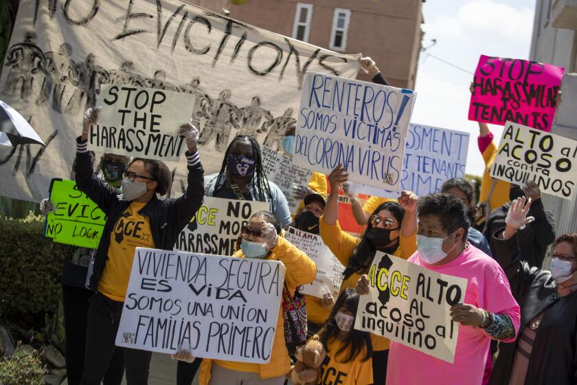 LOS ANGELES, CA - MAY 18: Tenants and housing rights advocates hold a rally with Jenise Dixon, second from left, in front of her Picfair Village neighborhood apartment on Tuesday, May 18, 2021 in Los Angeles, CA. Dixon is being harassed by her landlord, to(Brian van der Brug / Los Angeles Times)