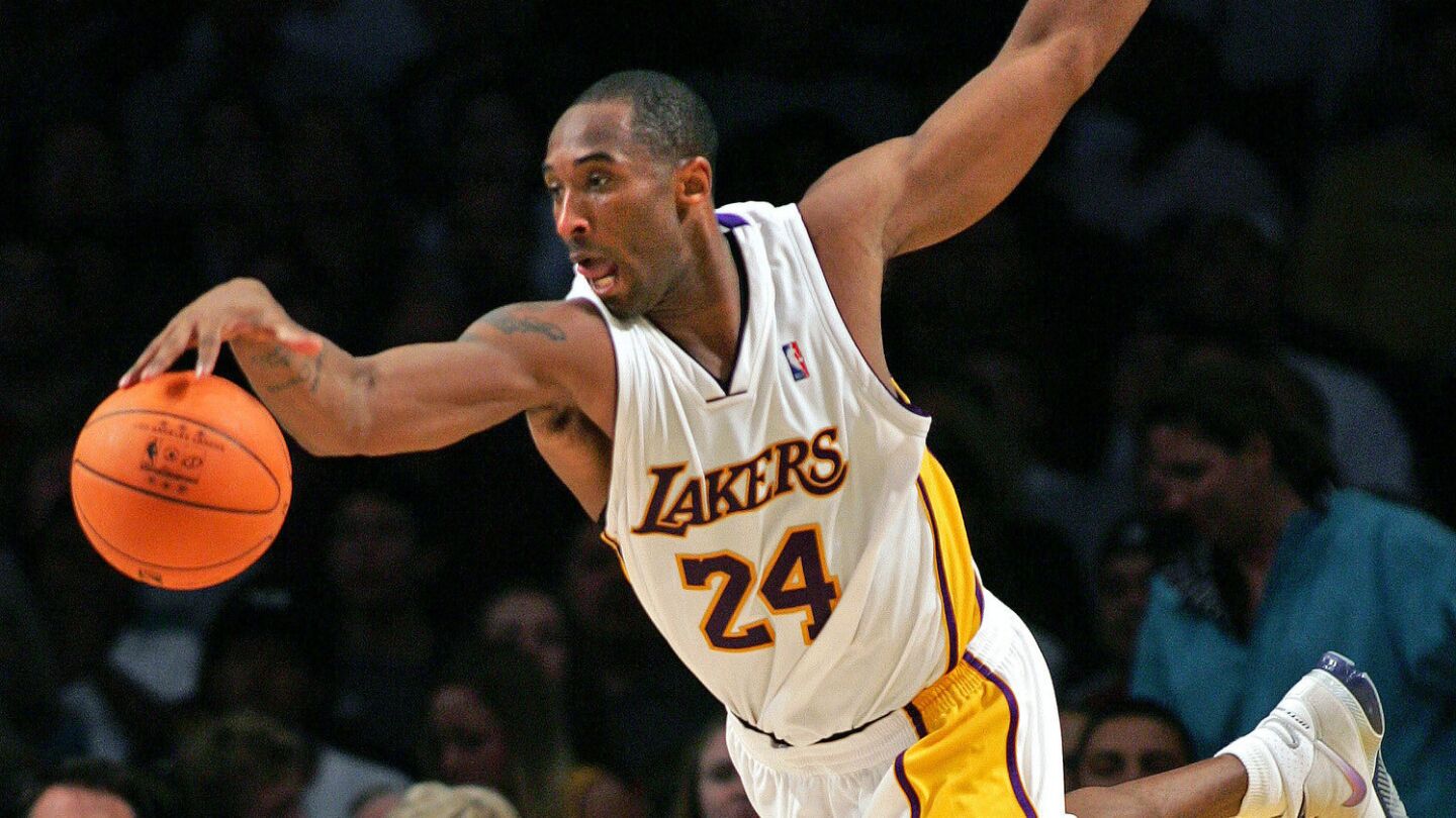 Kobe Bryant saves the ball from going out of bounds against the Memphis Grizzlies at Staples Center on Nov. 12, 2006.