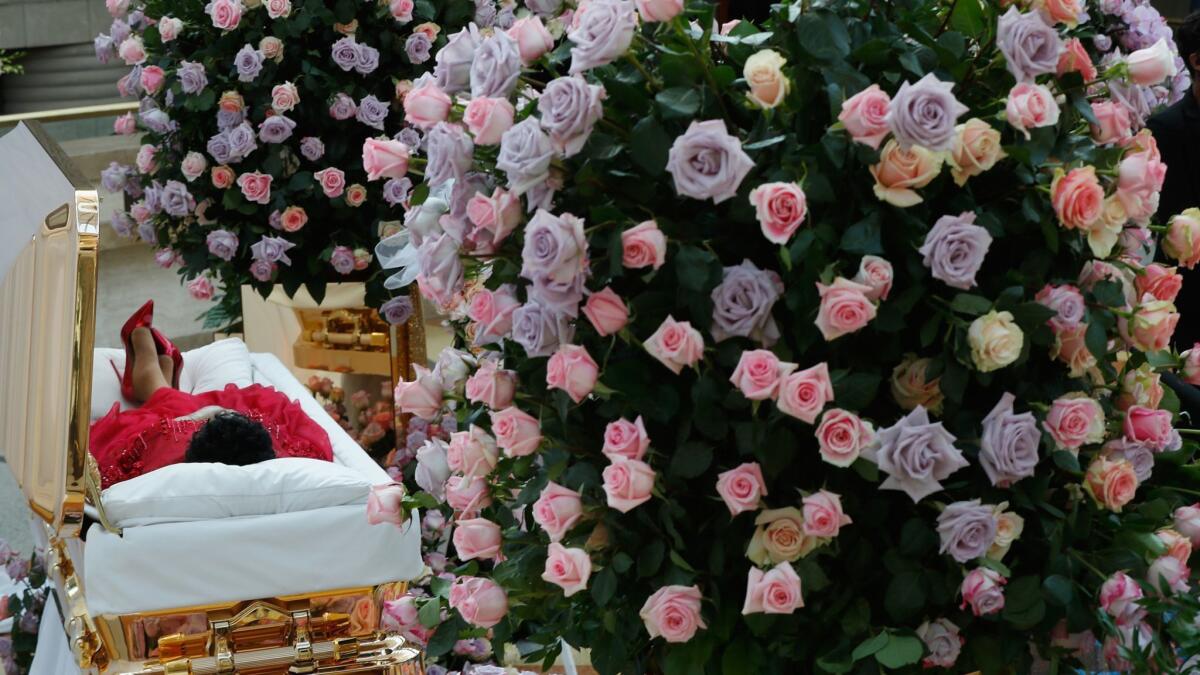The body of Aretha Franklin lies in repose at Detroit's Charles H. Wright Museum of African American History on Tuesday.