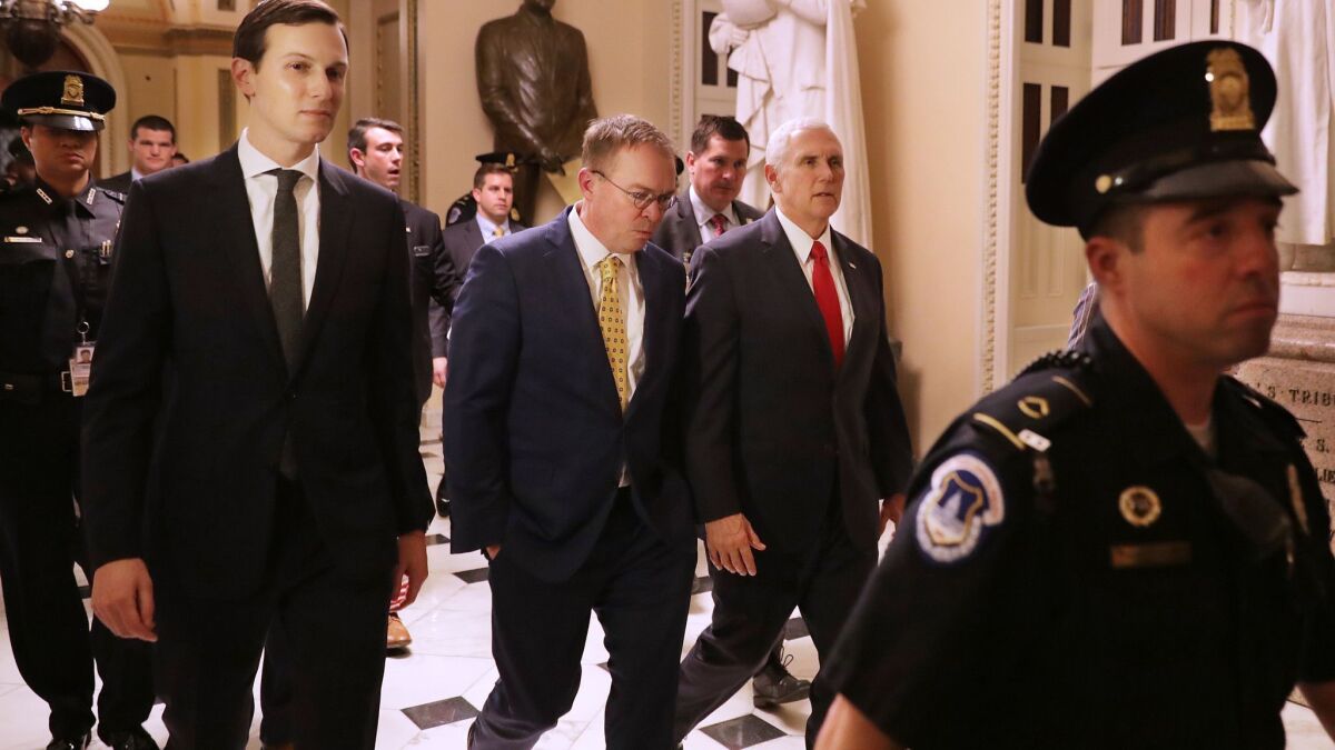 White House Senior Advisor Jared Kushner, acting Chief of Staff Mick Mulvaney and Vice President Mike Pence walk from the House of Representatives to the Senate while negotiating with lawmakers at the U.S. Capitol December 21, 2018 in Washington, DC.