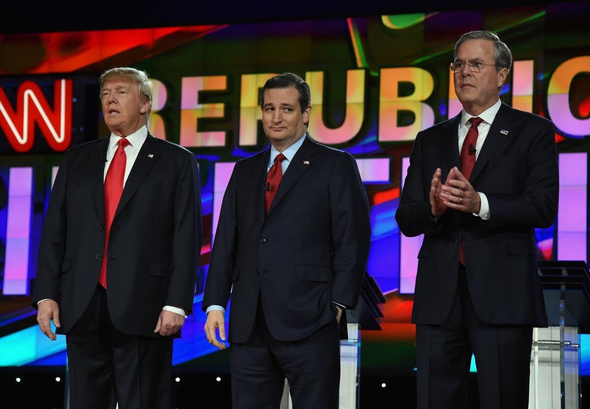 Republican presidential candidates Donald Trump, from left, Texas Sen. Ted Cruz and Jeb Bush stand on stage during the CNN debate in Las Vegas on Tuesday.
