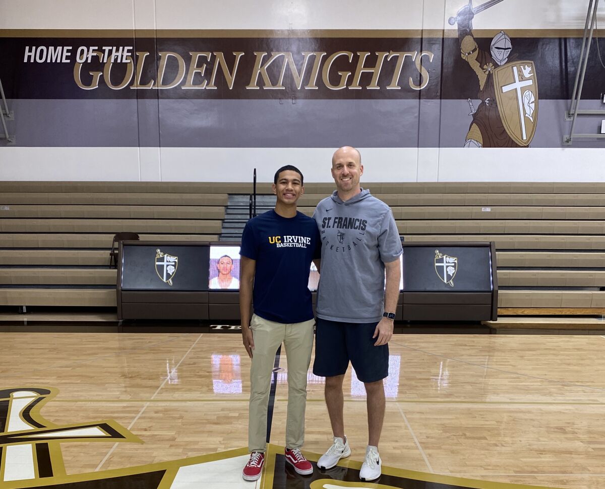 St. Francis guard Andre Henry, at left with coach Todd Wolfson, will play basketball for UC Irvine.