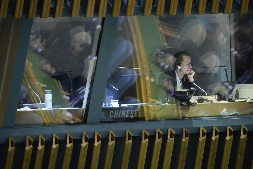 Delegates are seen reflected in a translator's booth addresses the 78th session of the United Nations General Assembly, Saturday, Sept. 23, 2023 at United Nations headquarters. (AP Photo/Mary Altaffer)