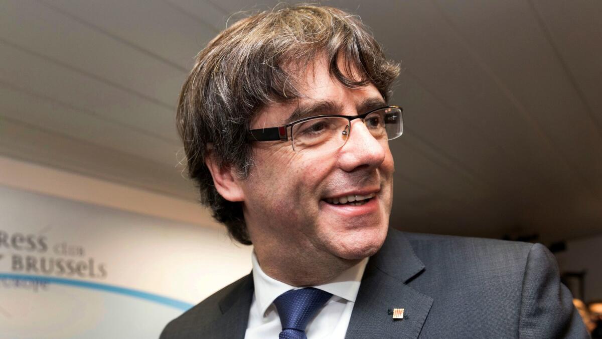 Ousted Catalan President Carles Puigdemont smiles after a news conference in Brussels on Oct. 31, 2017.