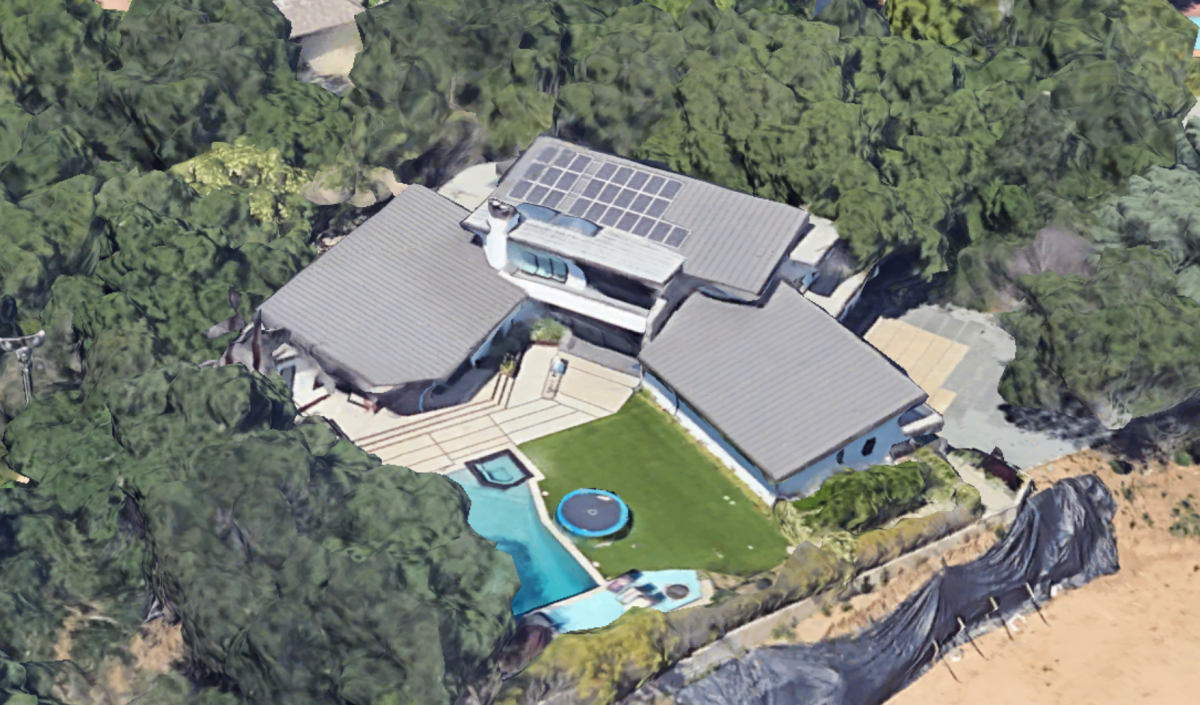 An aerial view of a modern mansion