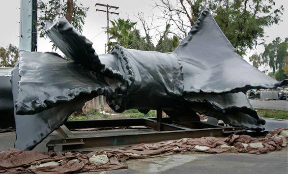 The 65-foot metal and fiberglass bow tie languishes in Irvine. When technical problems delayed the project, a two-year extension was granted, but the second deadline was missed as well.