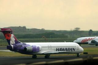 FILE - An Hawaiian Airlines plane taxis for position at Kahalui, Hawaii, on the island of Maui, March 24, 2005. Alaska Air Group said Sunday, Dec. 3, 2023, that it agreed to buy Hawaiian Airlines in a $1 billion deal. (AP Photo/Lucy Pemoni, File)