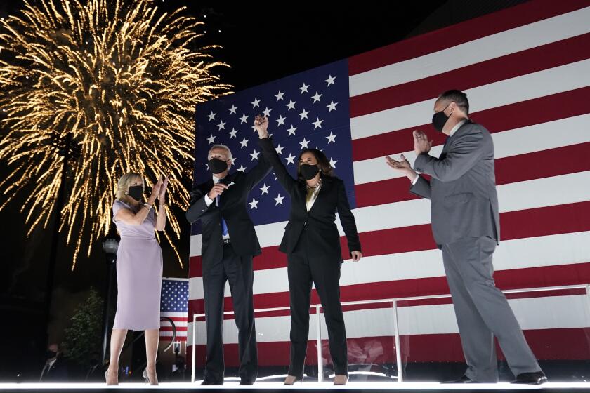 Democratic presidential candidate former Vice President Joe Biden, and his wife Jill Biden, watch fireworks