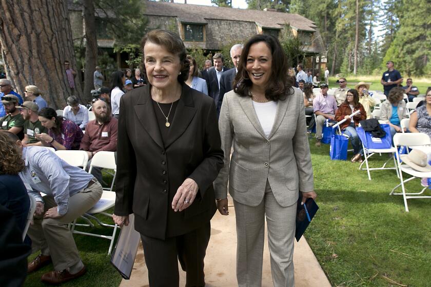 California's Democratic United States Senators, Dianne Feinstein, left, and Kamala Harris, walk together to speak at the 21st Annual Lake Tahoe Summit, Tuesday, Aug. 22, 2017, in South Lake Tahoe, Calif. The summit is gathering of federal, state and local leaders to discuss the restoration and to sustain Lake Tahoe.(AP Photo/Rich Pedroncelli)