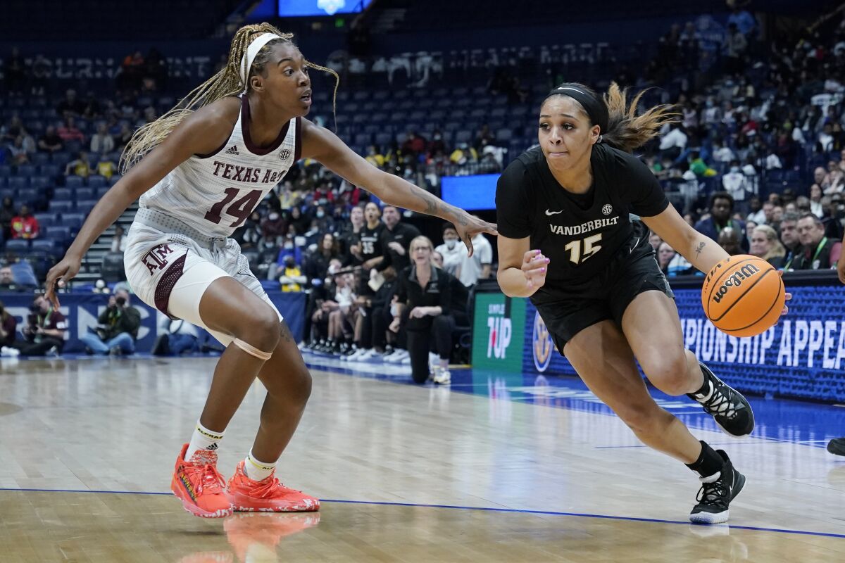Vanderbilt's Brinae Alexander (15) drives against Texas A&M's Maliyah Johnson (14) in the first half of an NCAA college basketball game at the women's Southeastern Conference tournament Wednesday, March 2, 2019, in Nashville, Tenn. (AP Photo/Mark Humphrey)