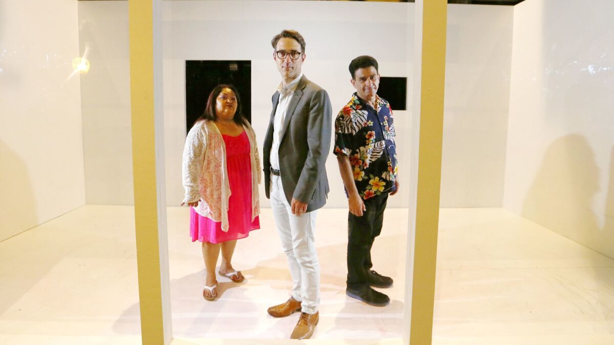 Director Jeff Janisheski, center, and Rising Scholars co-founder Irene Sotelo and actor John Pizzini are part of Long Beach Opera's production of "In the Penal Colony."