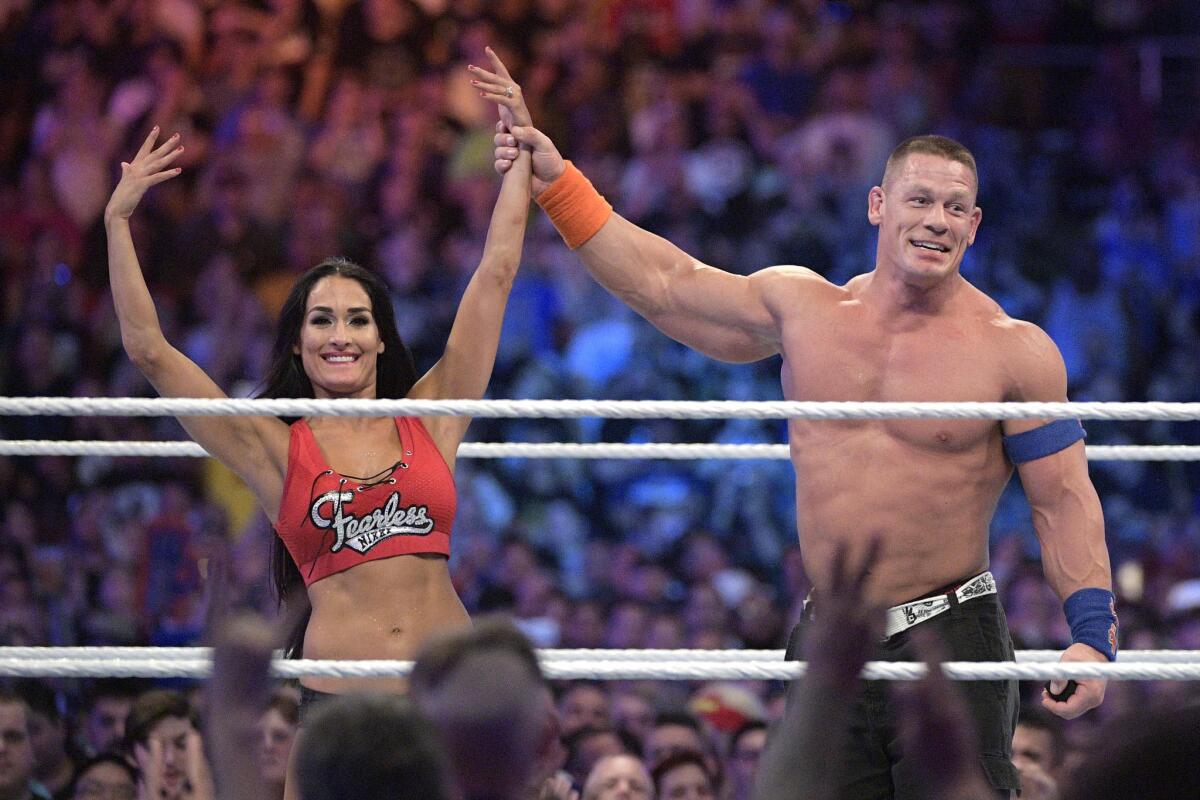 John Cena and Nikki Bella show off her new engagement ring at WrestleMania 33 in Orlando.