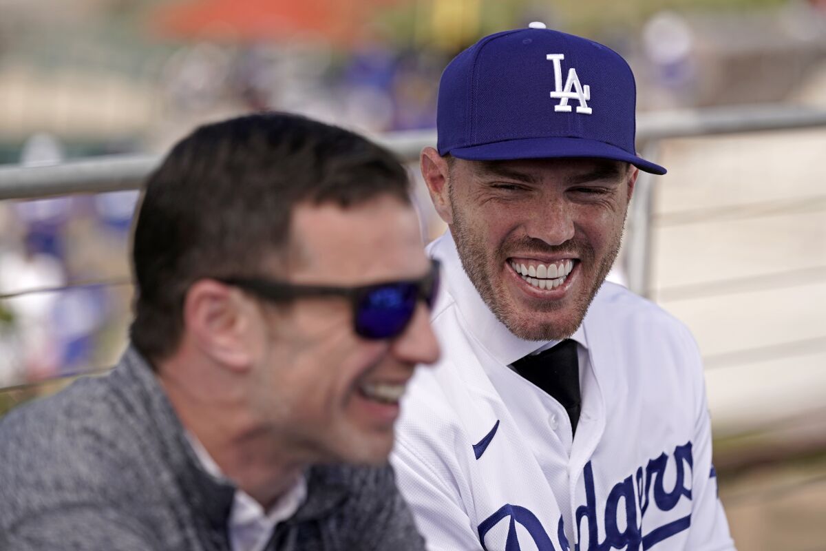 Andrew Friedman, the Dodgers’ president of baseball operations, left, shares a laugh with Freddie Freeman.