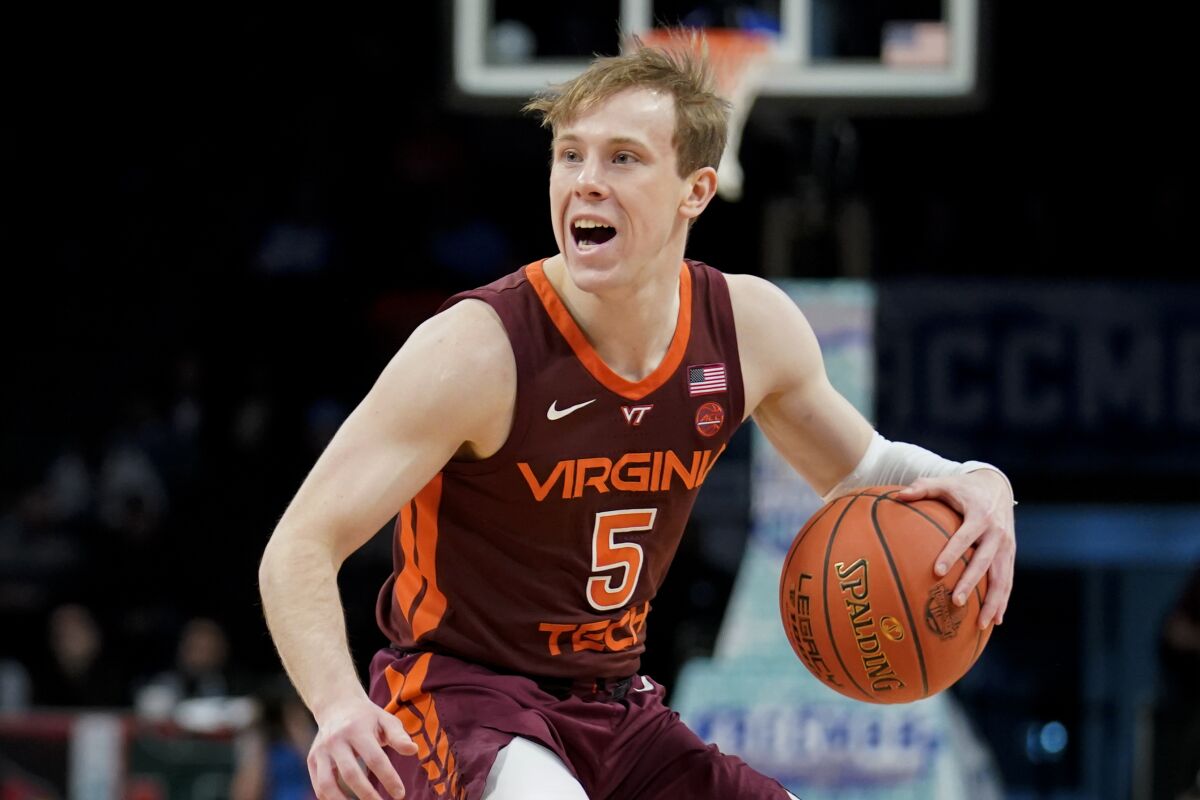 Virginia Tech's Storm Murphy (5) looks to pass in the first half of an NCAA college basketball game against the Notre Dame during quarterfinals of the Atlantic Coast Conference men's tournament, Thursday, March 10, 2022, in New York. (AP Photo/John Minchillo)