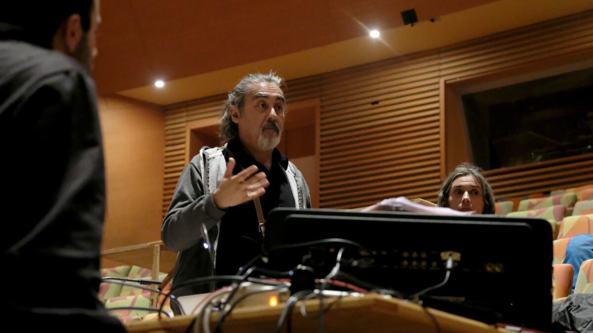 Juan Carlos Zagal talks through lighting for "Song of the Earth" during rehearsal at Disney Hall.