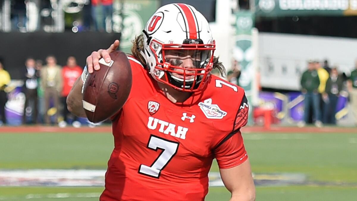 Utah quarterback Travis Wilson scores a touchdown during a 45-10 win over Colorado State at the Las Vegas Bowl on Saturday.