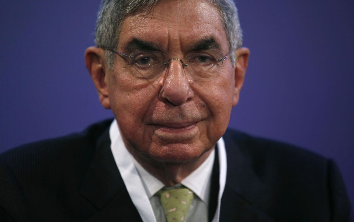 FILE - In this Nov. 13, 2015 file photo, Nobel Peace Prize laureate and two-time Costa Rican President Oscar Arias looks at the media during the opening ceremony of the XV World Summit of Nobel Peace Laureates at the University in Barcelona, Spain. The prosecutors' office said Monday, Sept. 7, 2020, that two women who had lodged sexual abuse complaints against the Nobel Peace Prize laureate and two-time Costa Rican President have withdrawn those complaints. (AP Photo/Manu Fernandez, File)