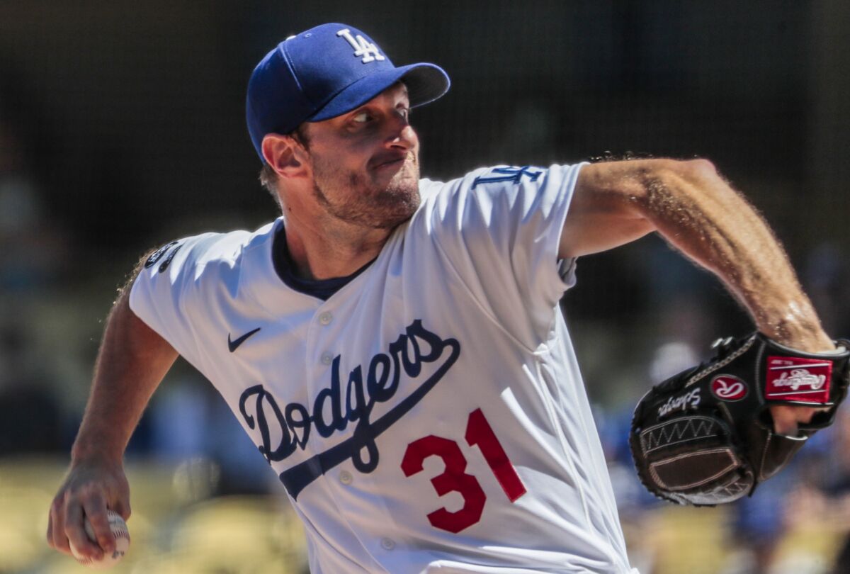 Dodgers starting pitcher Max Scherzer delivers against the San Diego Padres on Sunday.