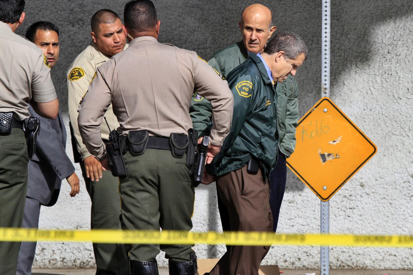 Sheriff Lee Baca visits an accident scene where a deputy was struck and critically injured by a car as he investigated a stranded or abandoned car along the Gold Line tracks in East Los Angeles.