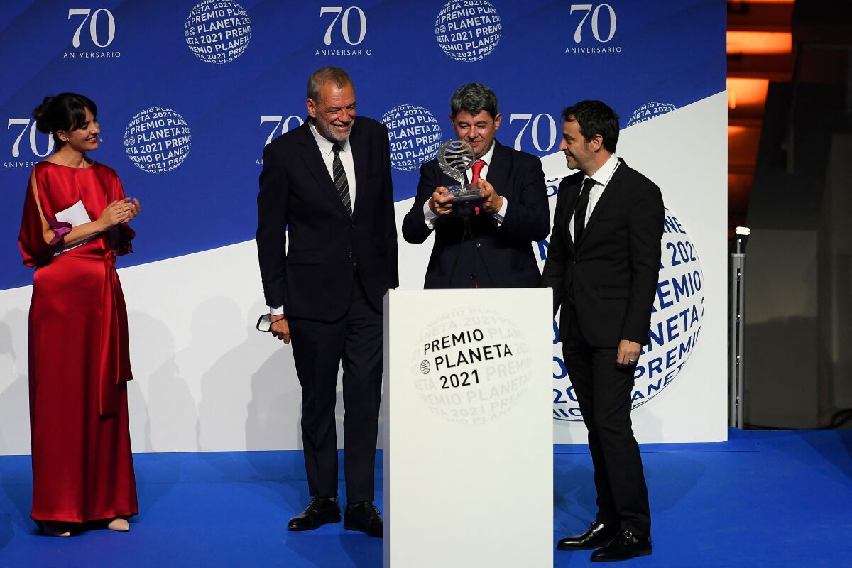 Premio Planeta award Jorge Diaz, Antonio Mercero and Augustin Martinez receive the trophy for their novel "La Bestia"