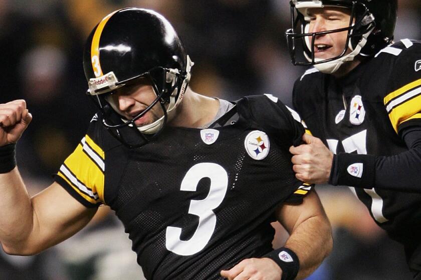 Steelers kicker Jeff Reed (3) and holder Chris Gardocki celebrate Reed's game-winning field goal against the New York Jets in January 2005.