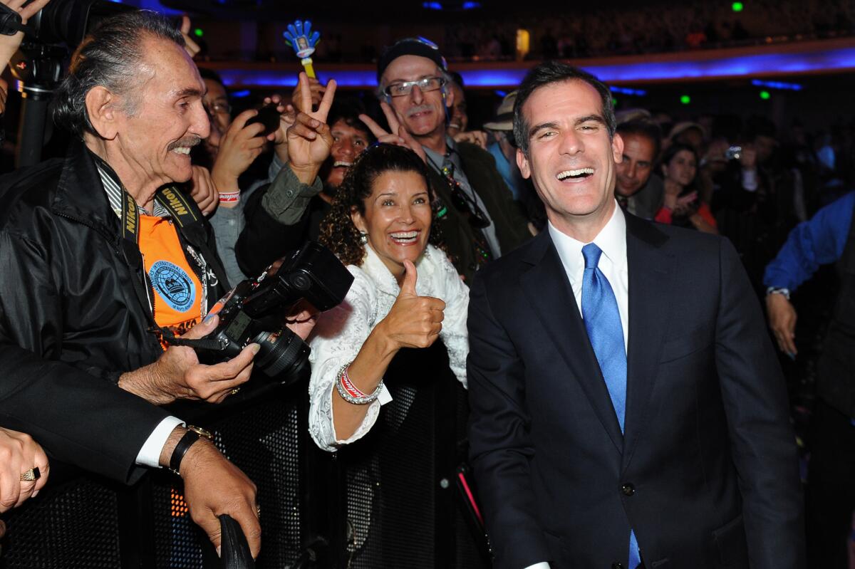 Eric Garcetti greets supporters at the Hollywood Palladium on election night back in May.