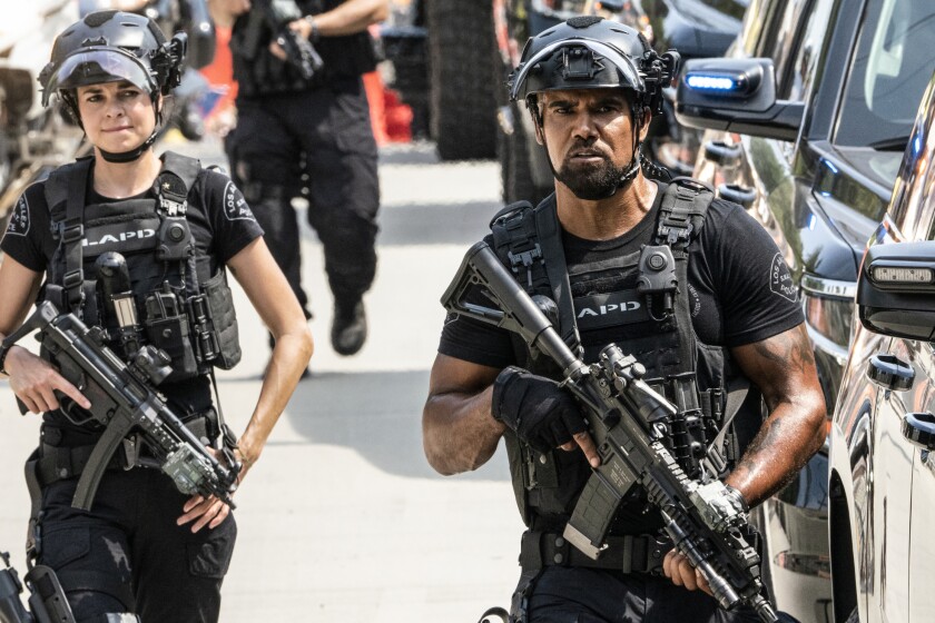 S.W.A.T. -- CBS TV Series, "Memento Mori" - The SWAT team searches for a rogue member of an extremist group planning to attack the memorial service of a famous musician who was outspoken about police brutality. Also, tension mounts between Hondo and Leroy (Michael Beach), Darryl's (Deshae Frost) father, when Leroy is released from prison early, on S.W.A.T., Wednesday, Nov. 25 (10:00-11:00 PM, ET/PT) on the CBS Television Network. Pictured (L-R): Lina Esco as Christina "Chris" Alonso and Shemar Moore as Daniel "Hondo" Harrelson. Photo: Bill Inoshita / CBS ©2020 CBS Broadcasting, Inc. All Rights Reserved. Lina Esco and Shemar Moore in "S.W.A.T." on CBS.