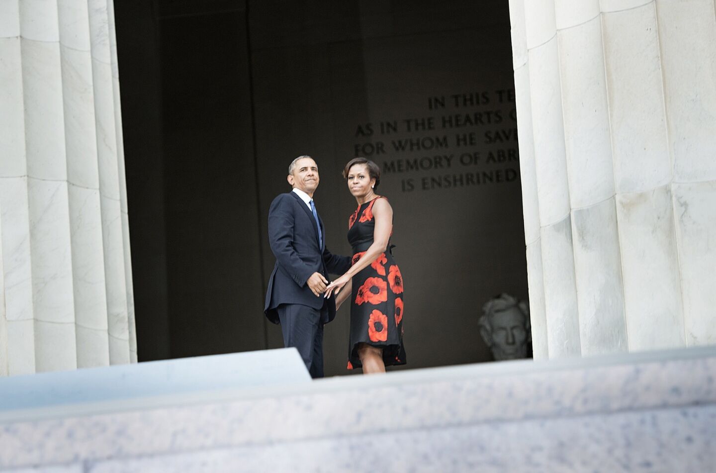 President Obama and first lady Michelle Obama walk into the Lincoln Memorial after speaking during the March on Washington commemoration.
