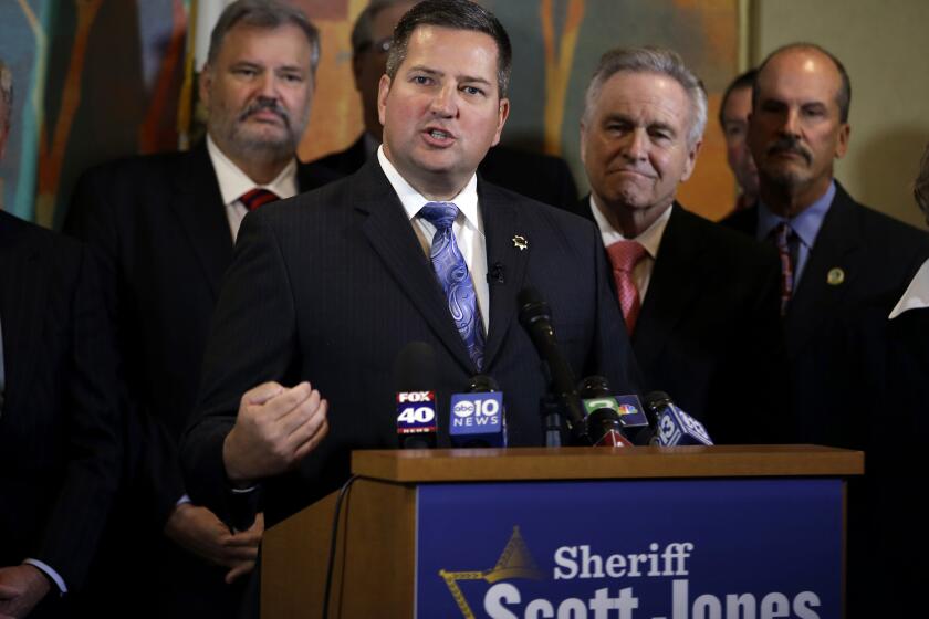 Sacramento County Sheriff Scott Jones announces his candidacy for California's 7th Congressional District seat during a news conference Monday.