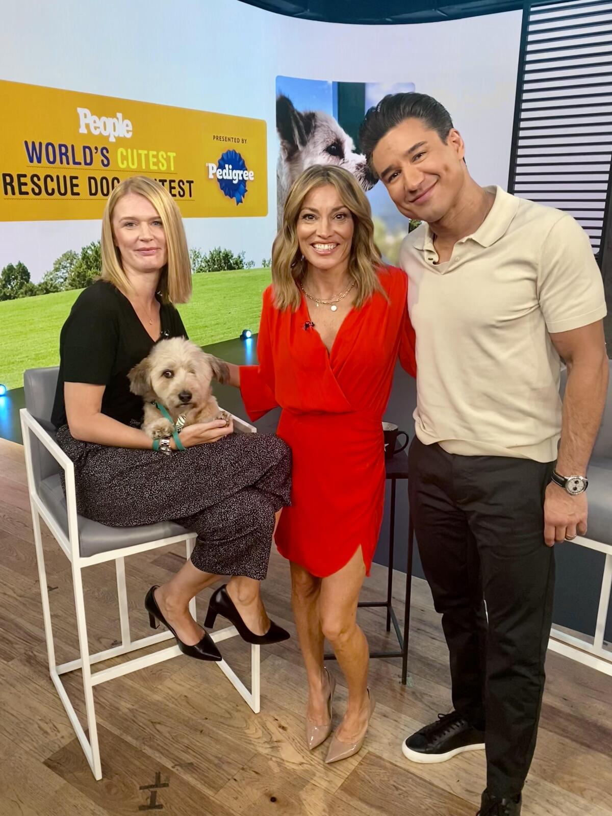 Coto de Caza resident Christin Bernardt, left, with dog Hobie and "Access Hollywood" hosts Kit Hoover and Mario Lopez.