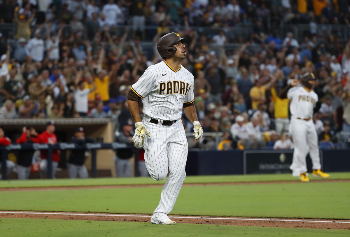 Padres' Daniel Camarena rounds the bases after hitting a grand slam against the Washington Nationals at Petco Park.