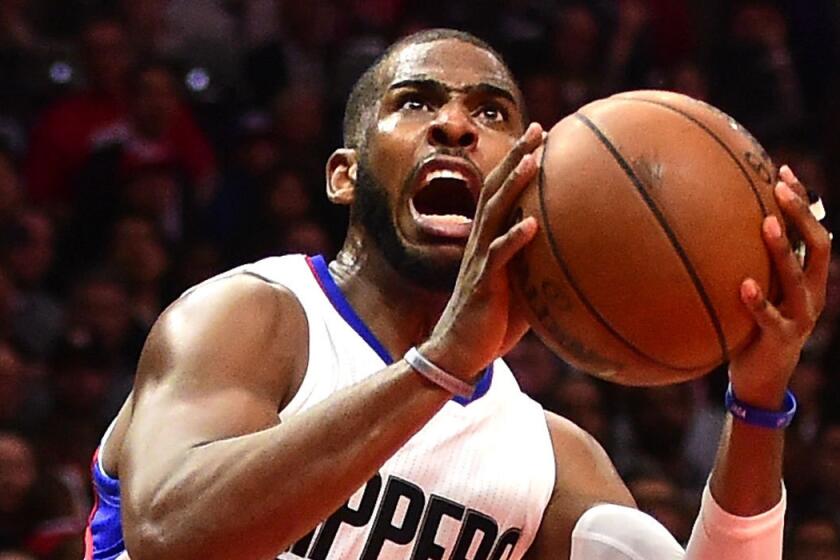 The Clippers' Chris Paul scores off an inbound steal against Oklahoma City on Monday night.