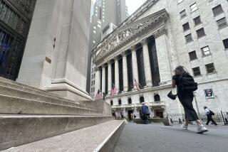 Pedestrians pass the New York Stock Exchange, on Tuesday, Aug. 20, 2024, in New York. (AP Photo/Peter Morgan)