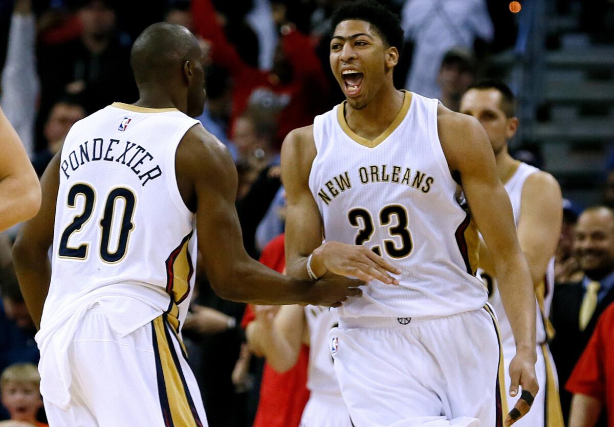 Pelicans center Anthony Davis celebrates after a victory.
