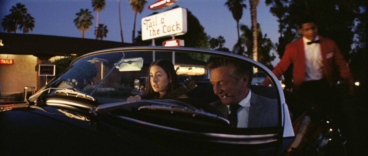 Alana Haim and Sean Penn in a scene from Paul Thomas Anderson's "Licorice Pizza."