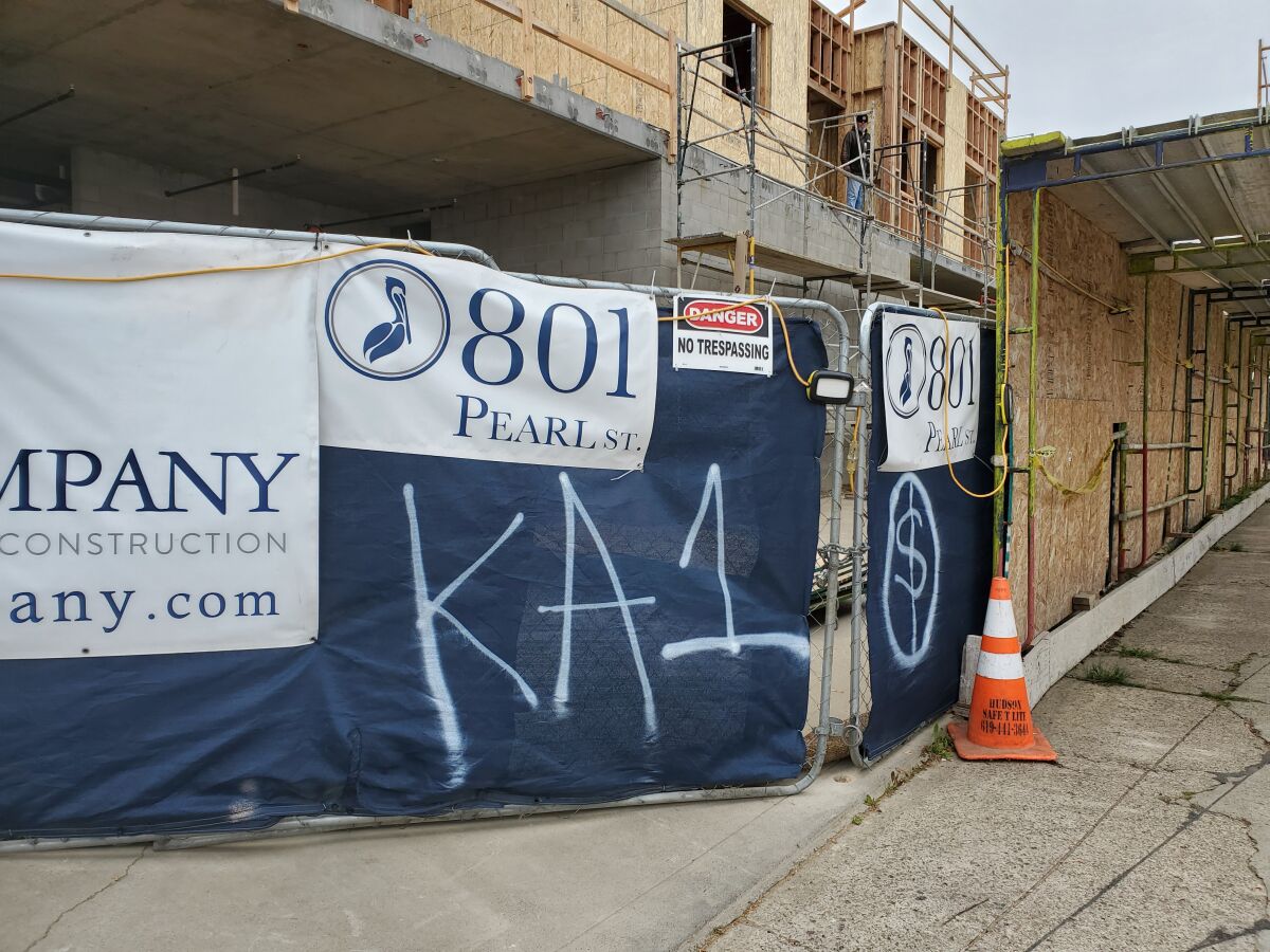 Graffiti sprayed on these construction tarps in La Jolla is believed to be part of a series of related tagging incidents.