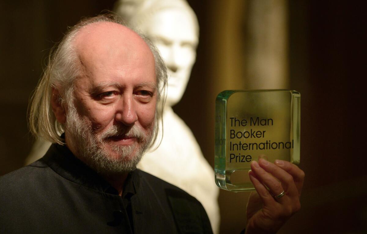 Hungarian author László Krasznahorkai displays his Man Booker International Prize in London on May 19.