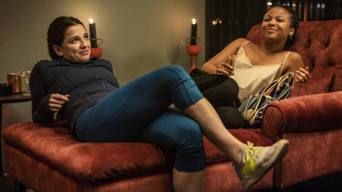 Marisa Abela and Myha'la Herrold on a chaise longue in the season finale of "Industry" on HBO.