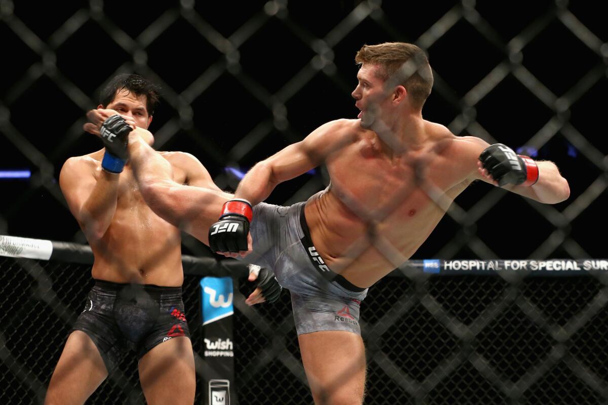 Stephen Thompson lands a kick against Jorge Masvidal during their welterweight bout at UFC 217.