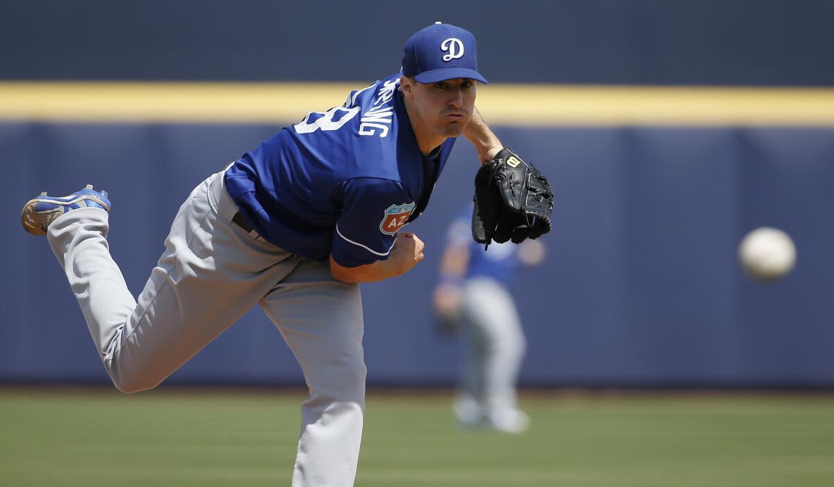 Ross Stripling warms up during the first inning of a spring training baseball game against the Padres on March 29.