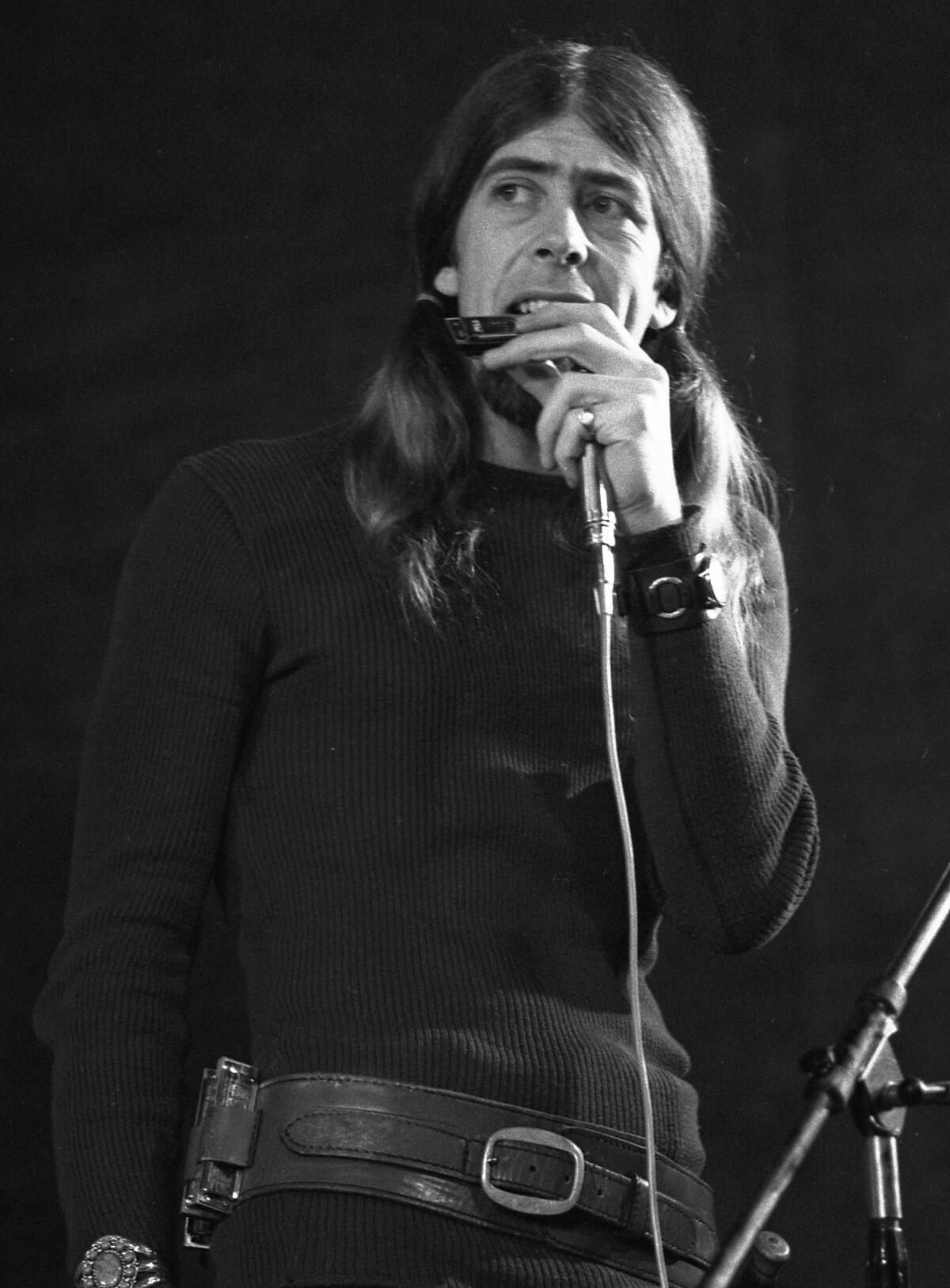 John Mayall performs in 1970 with his band the Bluesbrakers. 