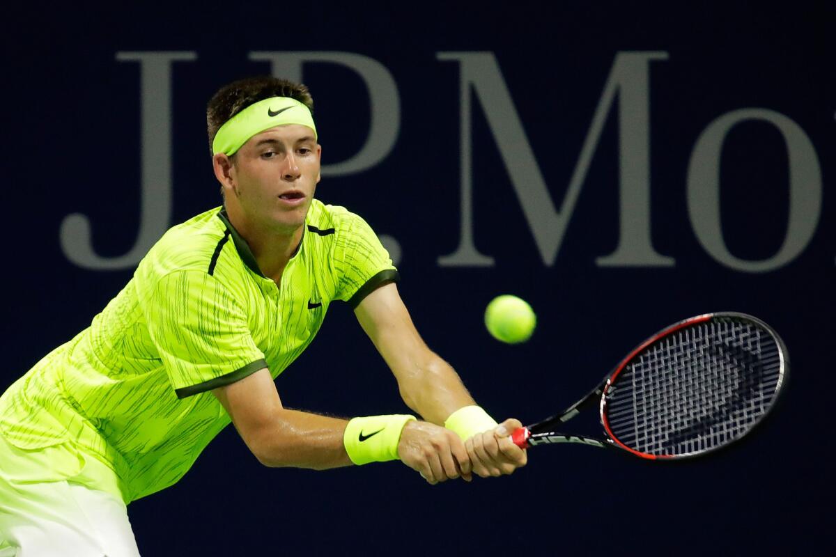 Jared Donaldson returns a shot to Viktor Troicki during a second-round men's singles match on Sept. 1 at the U.S. Open.