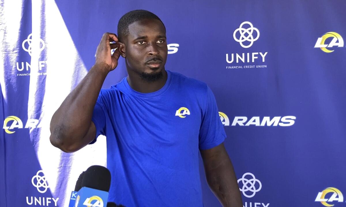 Sony Michel speaks with reporters when introduced as a Ram in 2021.