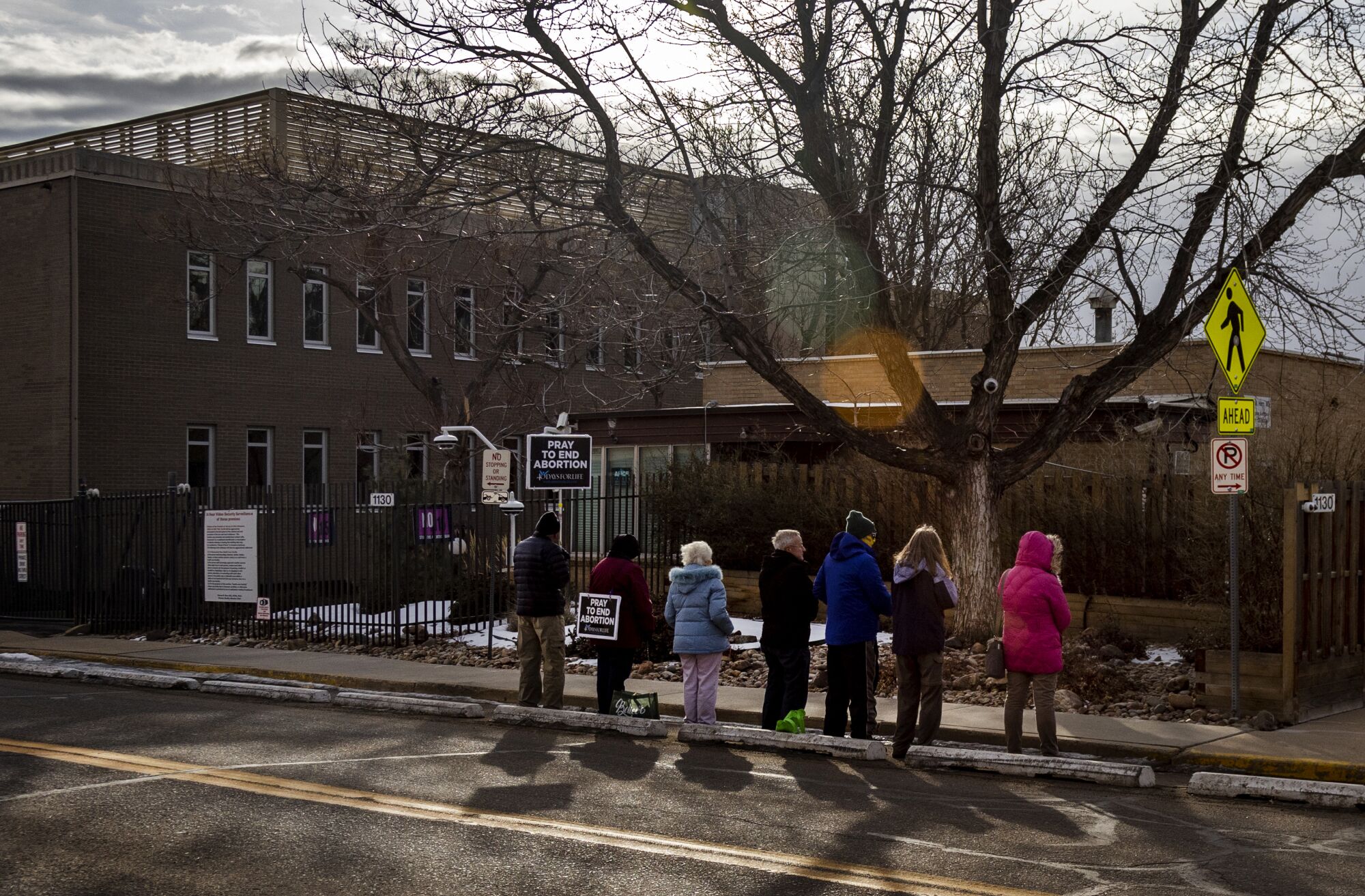 Antiabortion protesters pray in front of Dr. Warren Hern's clinic.