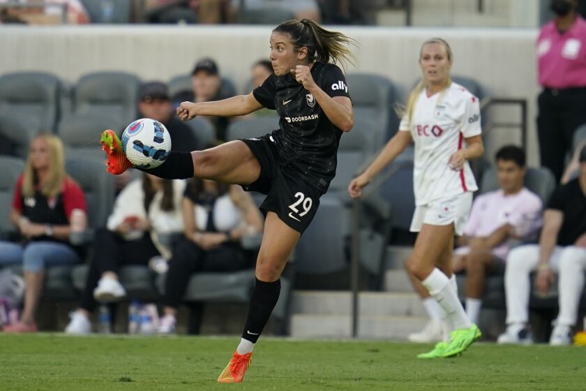 Angel City FC midfielder Clarisse Le Bihan (29) kicks during the second half of an NWSL soccer match against the Chicago Red Stars in Los Angeles, Sunday, Aug. 14, 2022. (AP Photo/Ashley Landis)